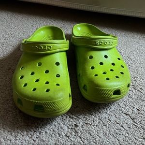 Neon green crocs. Used condition but they still have a lot of life.